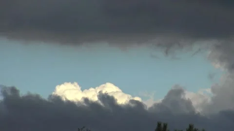 Band of blue sky between two dark clouds Stock Footage 159075527