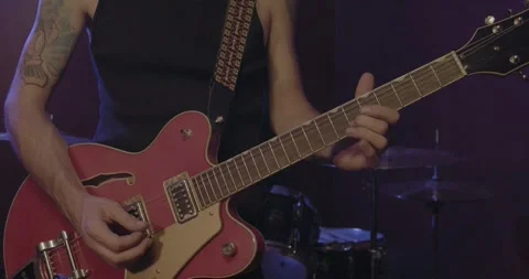 Band Instruments - guitar player Stock Footage 249348431
