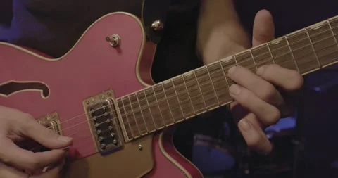 Band Instruments - playing guitar Video stock 249348490