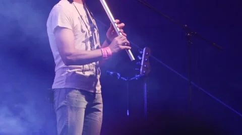 Band member playing on flute at open air rock festival Stock Footage 44207794