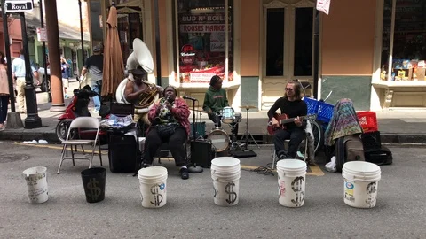 Band performing on a street corner in New Orleans Stock Footage