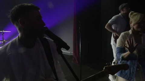 Band playing energetically and performing on stage Stock Footage 292887283