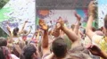 Band playing song on stage, people enjoying music at festival HD Footage