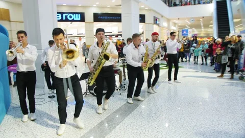 Band plays different instruments entertaining in mall Stock Footage 127747489
