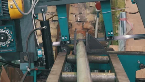 Band Saw Machine Cutting Plastic Pipe: Industrial Workshop Close-Up Stock Footage 343903546