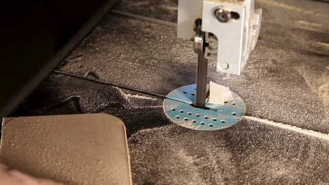 Band saw rounds the corners of a rectangular piece of wood, close-up. Video stock 100770357
