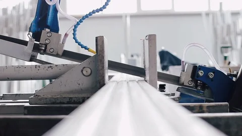 Band saw saws a stack of metal profiles for the production of plastic windows Vídeo Stock 129366181
