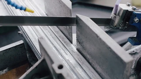 Band saw saws a stack of metal profiles for the production of plastic windows Vídeos de archivo 129366436