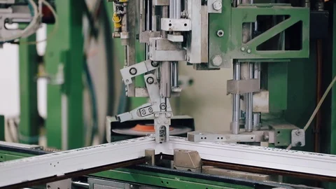 Band saw saws a stack of metal profiles for the production of plastic windows 库存影片 129383679