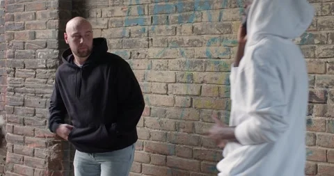 Bandit commits robbery attack on black man, day time. frightened victim Video stock 263661049