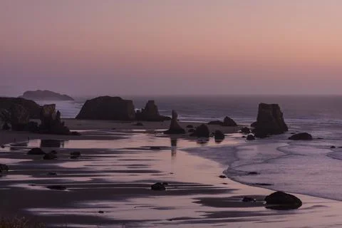 Bandon Beach at sunset with dramatic rock formations, Oregon, USA Stock Photos