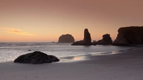 Bandon sea stack rock formations at sunset, Oregon Coast, Pacific Northwest, USA Stock Footage 108573993