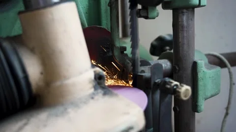 Bandsaw Blade Sharpening Machine Producing Sparks in Slow Motion Stock Footage 337657079
