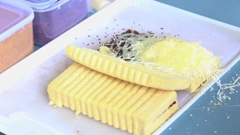 Bandung toast, the process of adding milk to Bandung toast Stock Footage 265789269