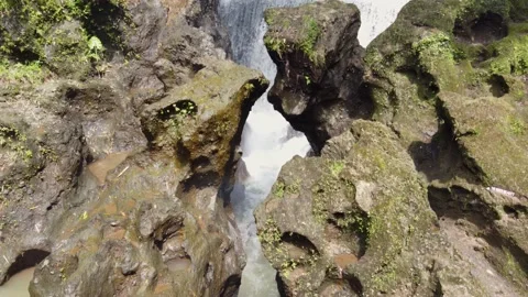 Bandung waterfall stream forcing its Way through stones of a rocky Canyon, Bali 스톡 동영상 238679835