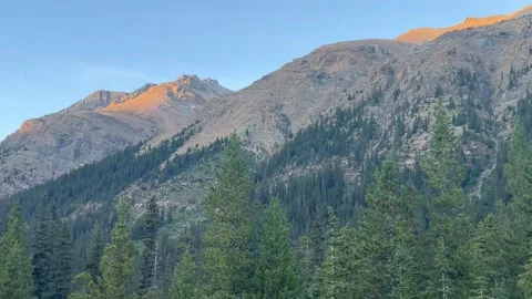Banff Canada September 03 2024 Rocky Mountains bathed in golden sunlight sunset 動画素材 343328804