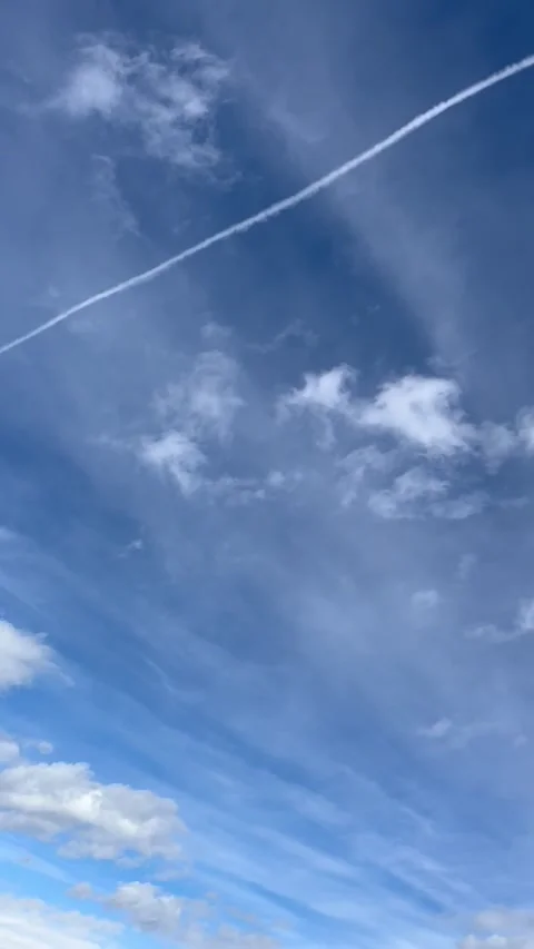 Banff Canada September 04 2024 plane leaving long contrail over Sulphur Mountain Stock Footage 343696752