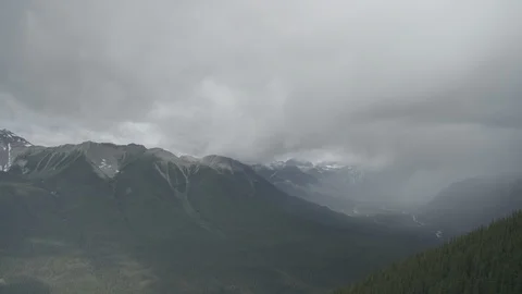 Banff time lapse view of cloudy Canadian Rockies - 4k Prores 422 N-Log Stock Footage 113361229