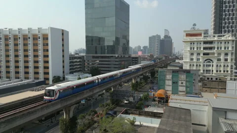 Bangkok BTS Skytrains Pass Each Other At Bang Chak Station Thailand Drone Slow Stock Footage 337547245