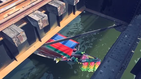 Bangkok -Elevated view of long-tail boat cruising on river. Seen from railway br Stock Footage 85478067