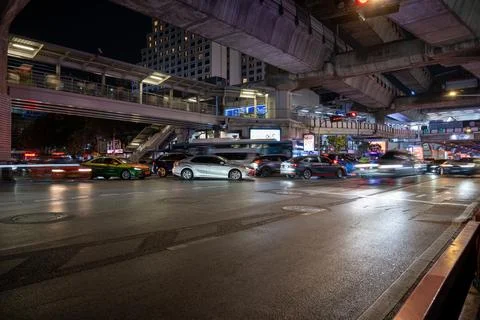 Bangkok Night Traffic Beneath Elevated Transit Infrastructure Stock Photos