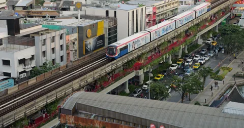 Bangkok Skytrain ride on elevated railway tracks in Thailand, slow motion Stock Footage 326382045