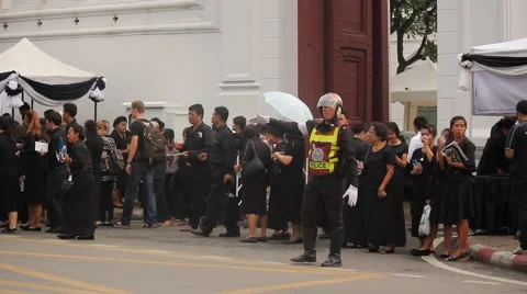 BANGKOK, THAILAND - Mourners queue to exit the Grand Palace Stock Footage 69062591