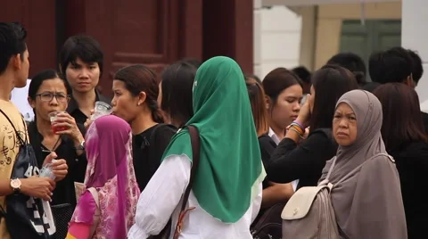 BANGKOK, THAILAND - Mourners queue to exit the Grand Palace Stock Footage 69063964