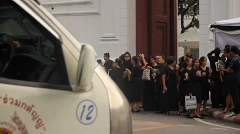 BANGKOK, THAILAND - Mourners queue to exit the Grand Palace Stock Footage 69064109