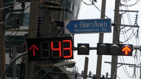 Bangkok, Traffic light countdown timer on Ratchadaphisek road sunny day Stock Footage 249371886