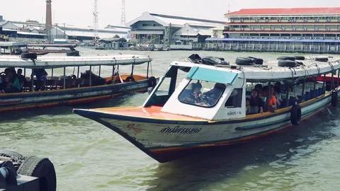 Bangkok - View of Chao Phraya river with boats leaving and arriving at pier. 4K Stock Footage 85478169