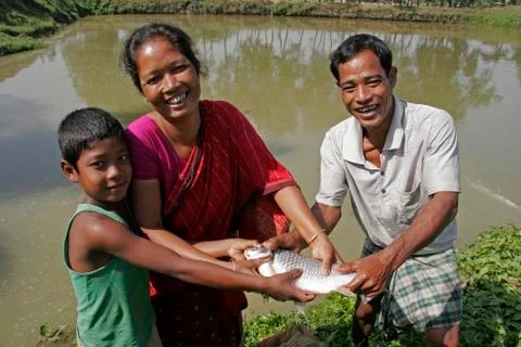 Bangladesh family with fish caught in their pond Stock Photos