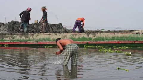 Bangladesh Workers Unloading Clay Soil From River Barge Man Washing Brick Stock Footage 337222380