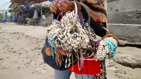 A bangle seller by the sea Stock Footage 132208099