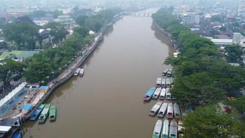 Banjarmasin's Siring river area which is filled with rental engine boats us.. Stock Footage 254454841