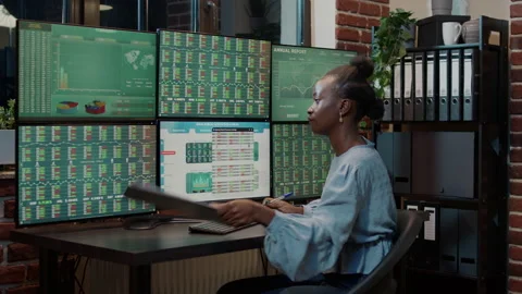 Bank analyst taking notes on clipboard to plan financial strategy Stock Footage 170783531