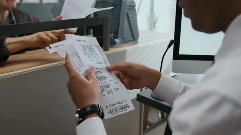 Bank Assistant Reviewing Recipes While Elderly Woman Arguing with Him Stock Footage 310132471