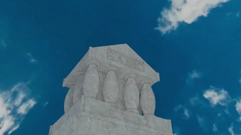 Bank building statue over cloudy sky in time-lapse Stock Footage 314486594