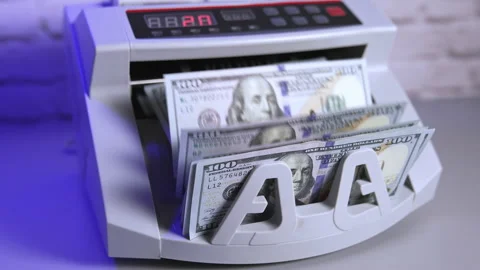 Bank cash counter machine with a stack of dollars.  Stock Footage 163756444