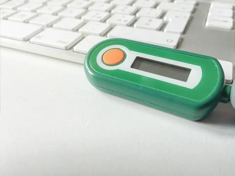  bank code generator with an orange button on a computer keyboard bank cod... 스톡 사진