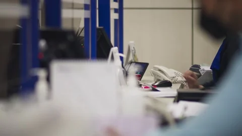 Bank Employee Processing Documents at Desk Stock-Footage 344235905