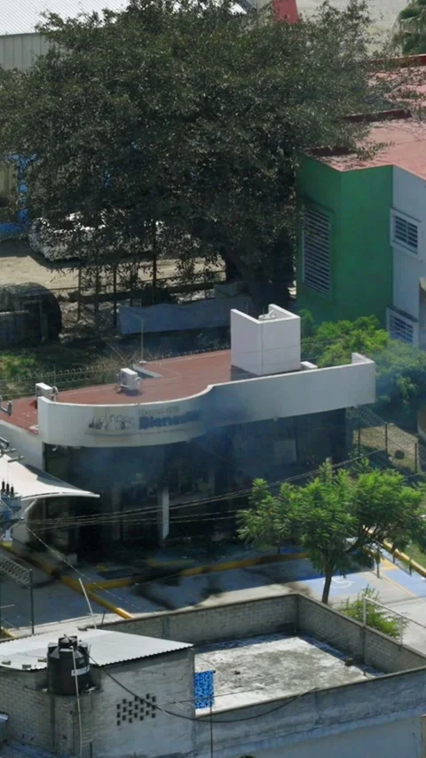 Bank fire marks aftermath of cartel violence in Jalisco, Mexico after reported Stock Footage 331146445