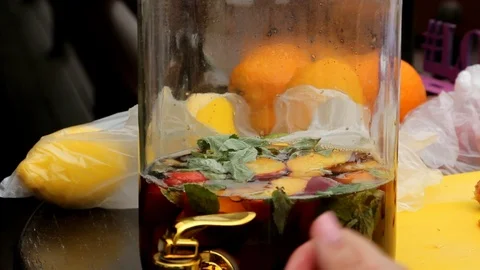 A bank with a fruit refreshing drink stands on a wooden table, close-up Stock Footage 89296847