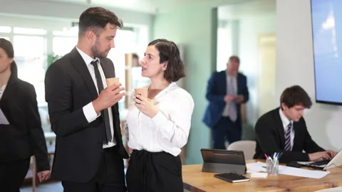 Bank office managers stand with a cup of hot coffee against the background of Stock Footage 341431811