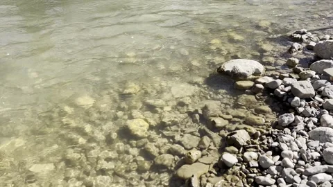 The bank of a spring mountain river is late in the morning. Stock Footage 330498841