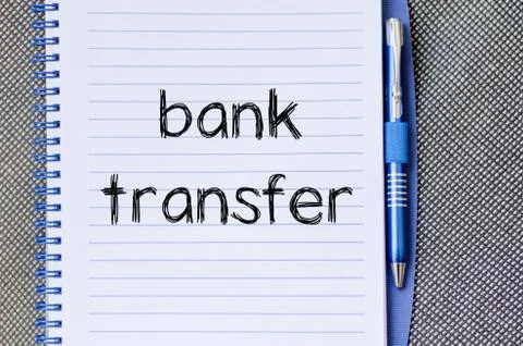 Bank transfer text concept on notebook Stock Photos