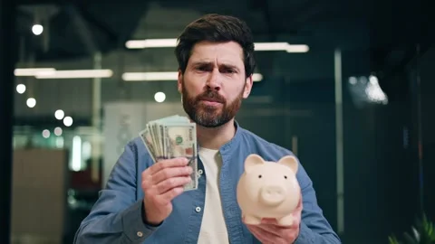 Bank worker telling about profitable investment with stack of dollar bills Stock Footage 264470722