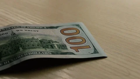 Banker considers dollars Stock Footage 77263508