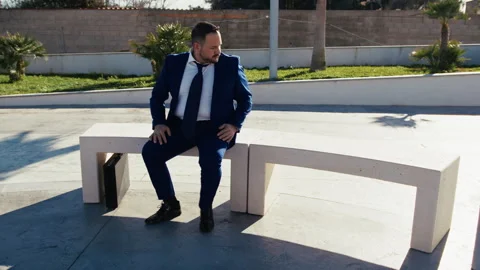 Banker Sitting On A Bench Waiting Stock Footage 310694079