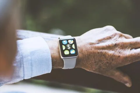 Banking application with dollar sign on smart watch touchscreen Stock Photos